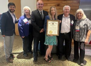 Members of World BioHazTec including the President, Kerstin Haskell holding the proclamation