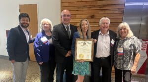 Members of World BioHazTec including the President, Kerstin Haskell holding the proclamation
