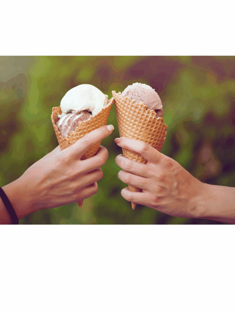 Two different hands holding ice cream cones
