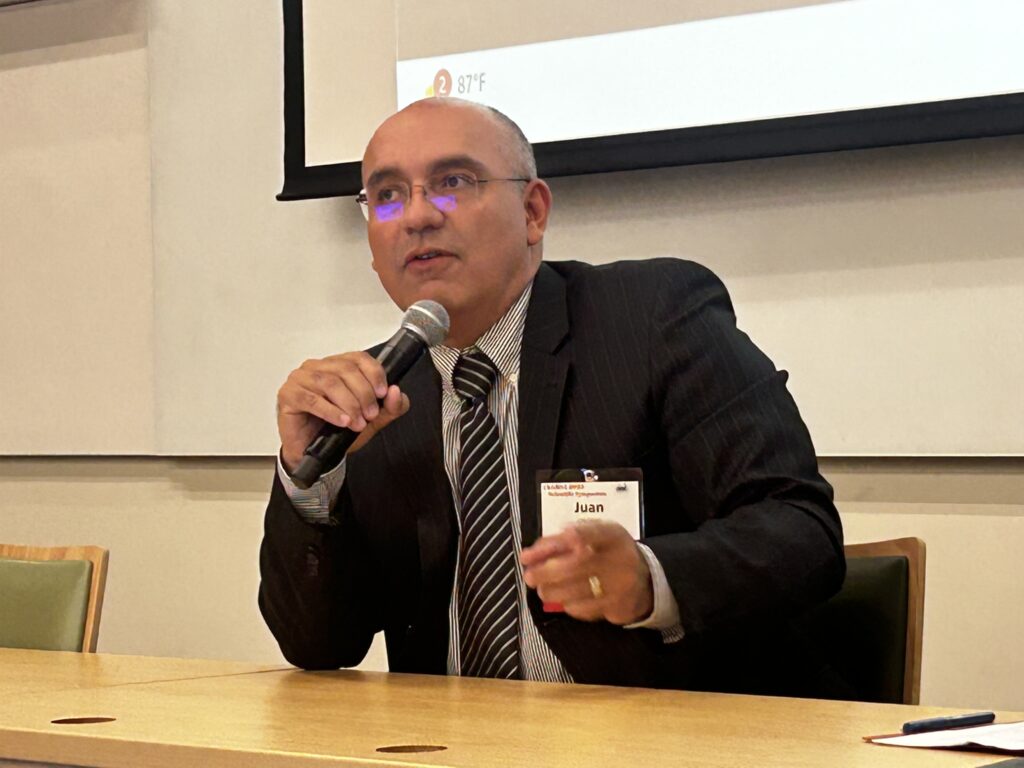 Man wearing a suit speaking