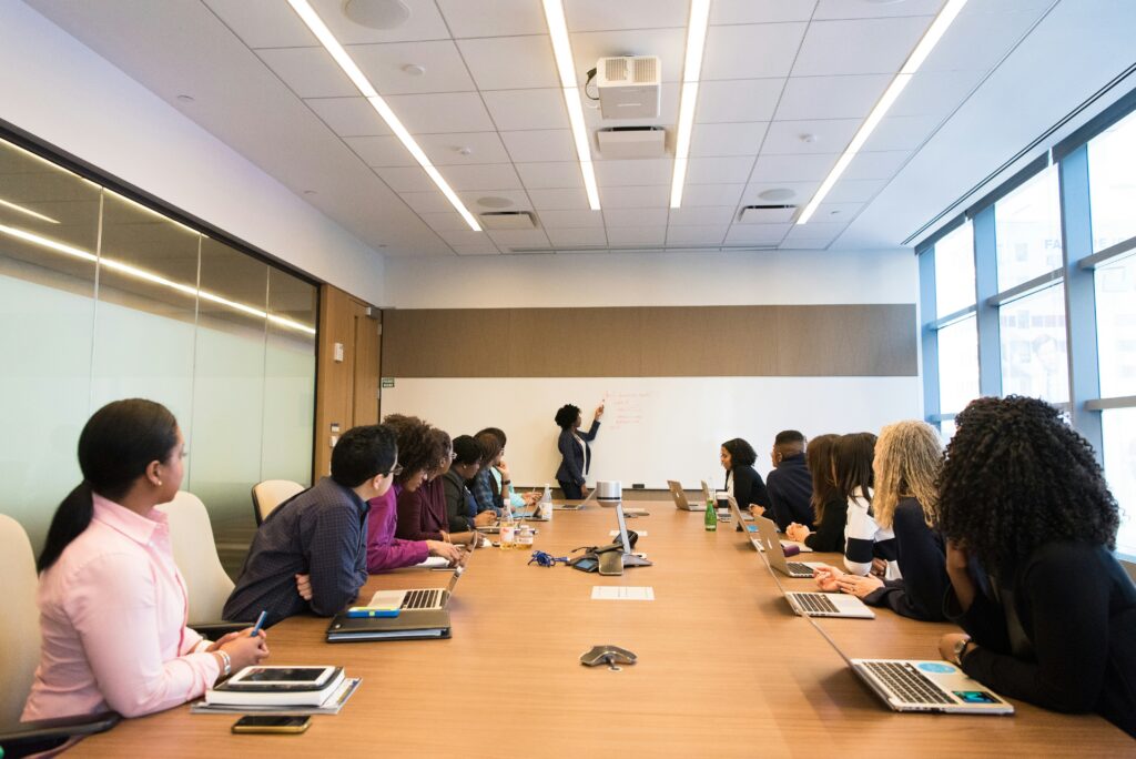 A large meeting taking place in a boardroom